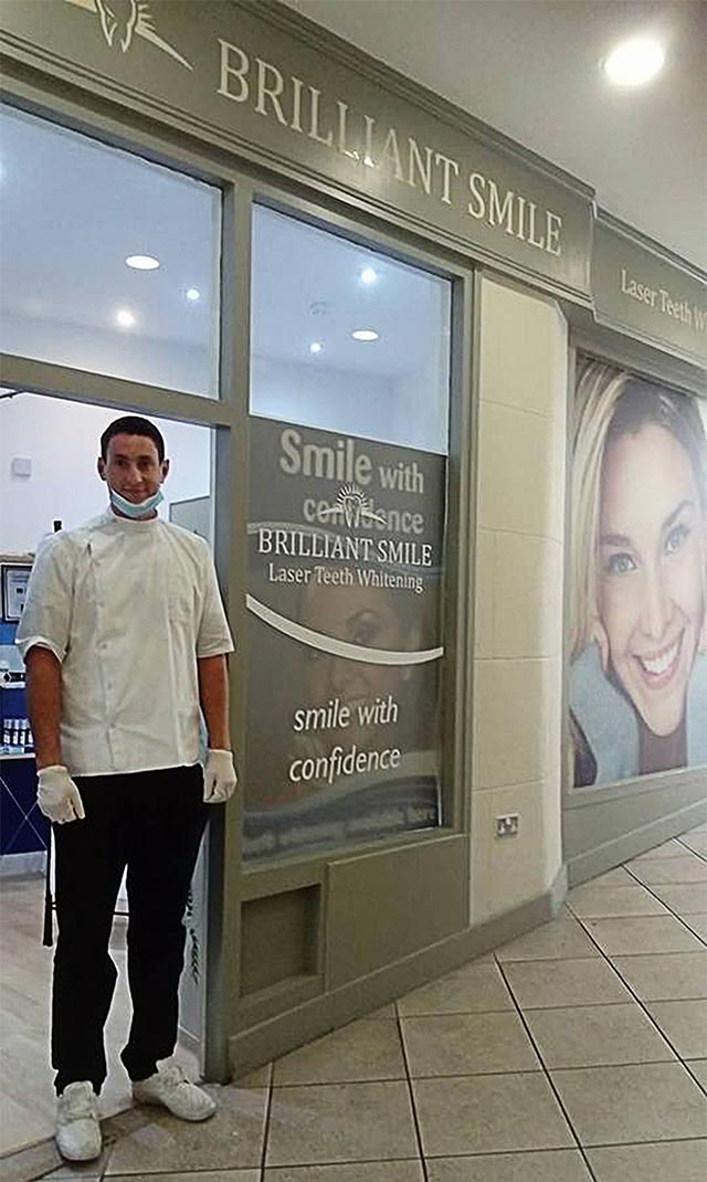 Roman in front of Brilliant Smile