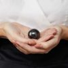 Shungite-sphere-hands